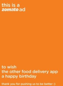 Zomato Print Advertising newspaper advertisement wishing Swiggy a happy birthday.